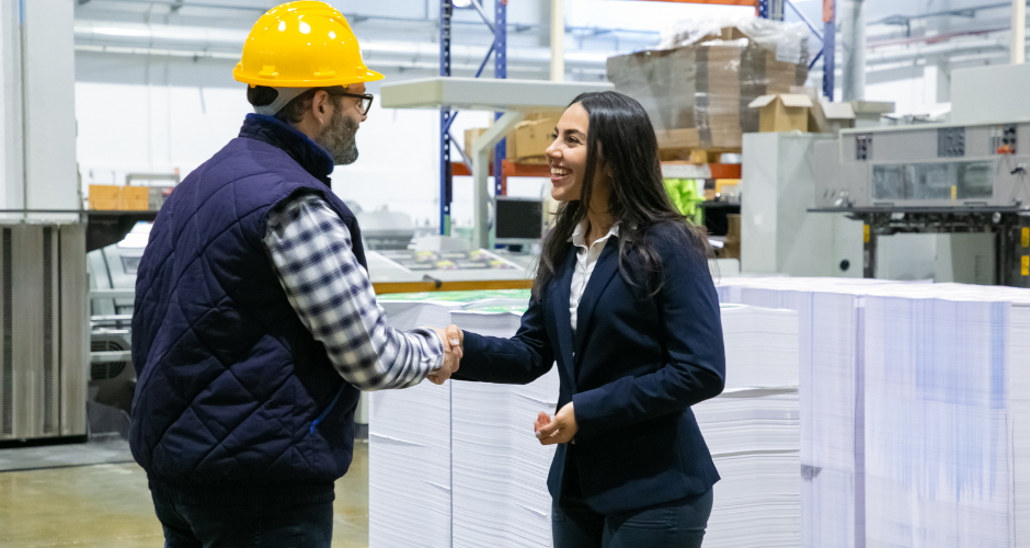 A engineer shaking hands with his customer, as they kick off their ETO project.